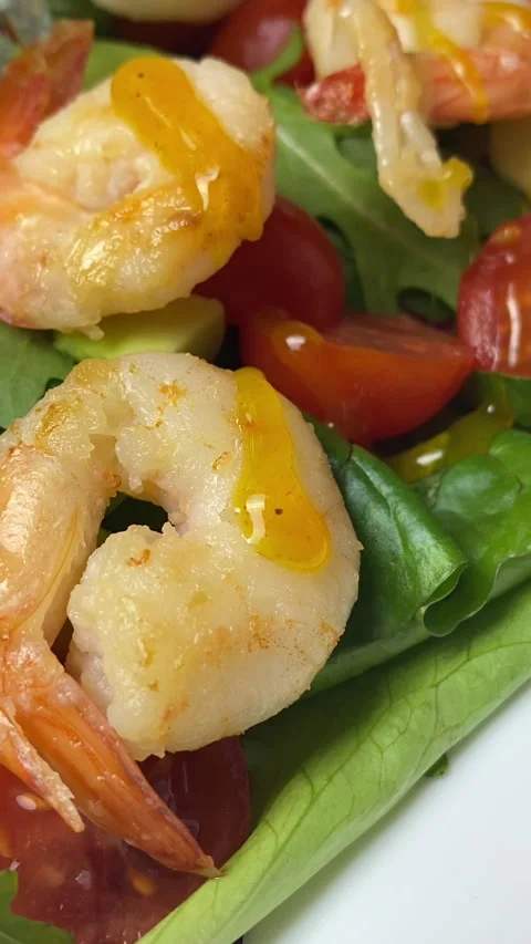 Vertical screen: Close-up of shrimp salad with sauce and chef pouring sauce. Stock Footage 240540602