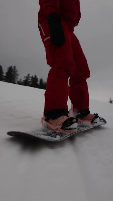 Vertical screen close up snowboard boots on board Stock Footage 327092313