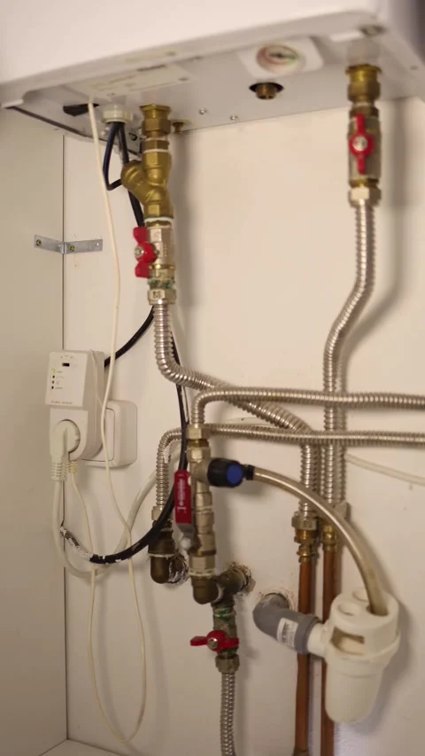 Vertical screen close view of metal pipes valves and water connections inside wh Stock Footage 318867751