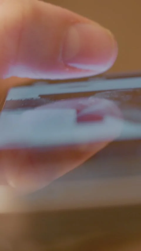 Vertical Screen Close up of woman scrolling on smartphone screen Stock Footage 317976579
