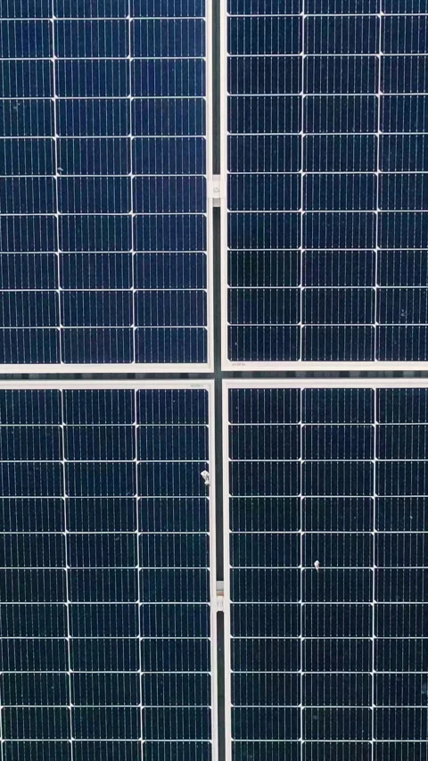 Vertical Screen: Closeup of surface of blue photovoltaic solar panels mounted on Stock Footage 272163344