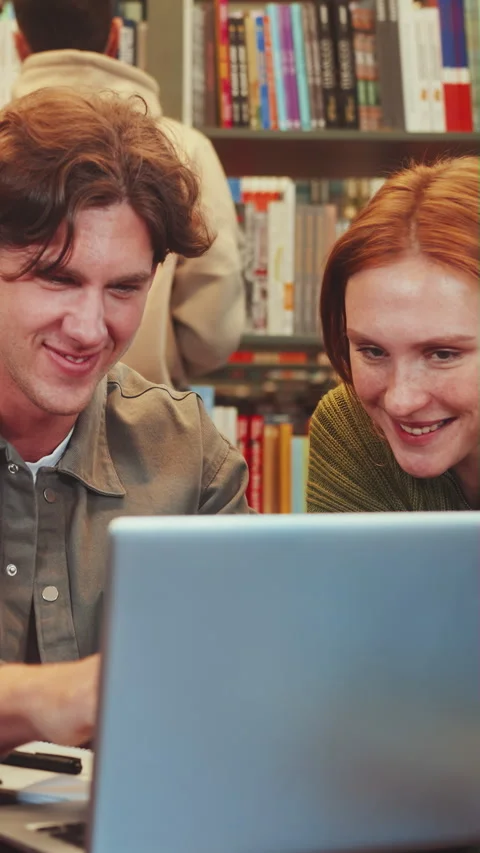 Vertical screen: Collaborative Study Session in Library Stock Footage 269837232