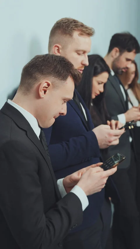 Vertical screen: Colleagues Using Smartphones During Break Stock Footage 281149521