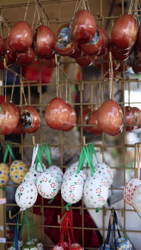 Vertical screen colorful hand-painted Easter eggs hang in rows traditional folk  Stock Footage 306677934