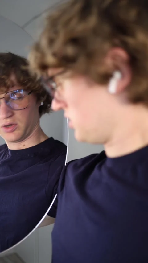 Vertical screen confused and shocked the guy suddenly pauses mid-thought staring Stock Footage 313268938