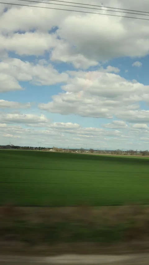 Vertical screen countryside landscape with dramatic clouds and sunlight moving a Stock Footage 306596731