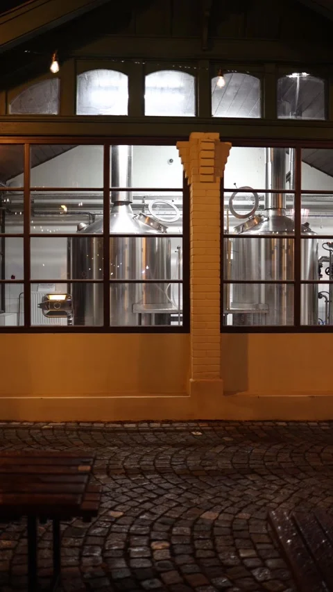 Vertical screen: A cozy brewery seen through large windows, industrial metal tan Stock Footage 307623663