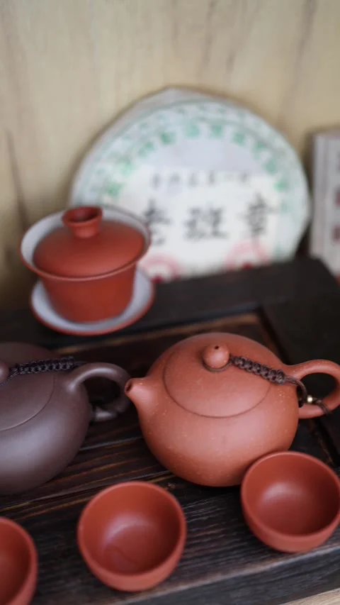 Vertical Screen: A cozy tea corner featuring a Yixing clay teapot, a glass pitch Stock Footage 304623043
