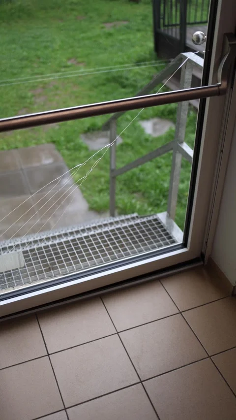 Vertical screen cracked glass door with visible deep fractures, view from inside Stock Footage 307699660