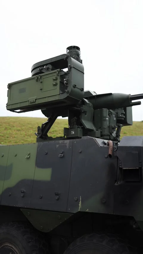 Vertical screen cutting-edge missile turret on armored carrier stands firm again Stock Footage 311149752