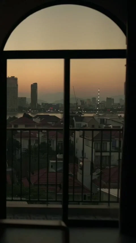 Vertical screen Da Nang, Vietnam Balcony Sunset City Skyline, Arched Window Stock Footage 333197907