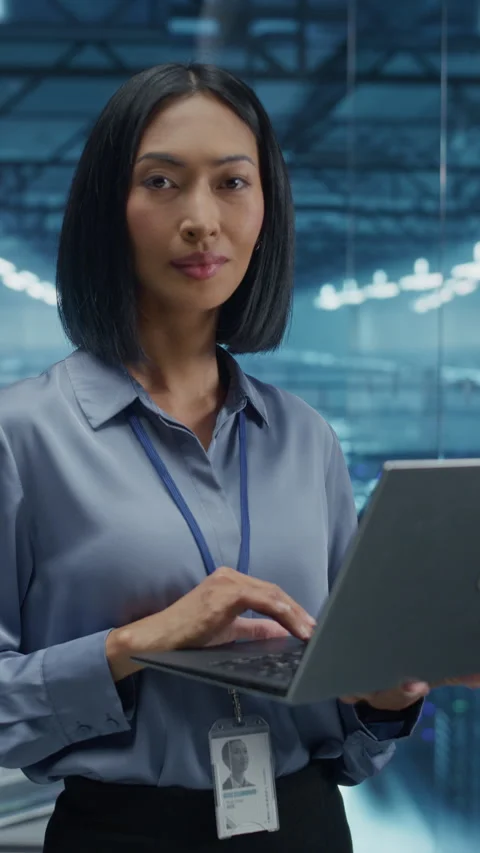 Vertical Screen Data Center Specialist Using Laptop Computer Stock Footage 296176036