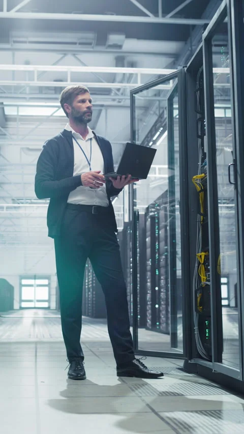 Vertical Screen Data Center Specialist Using Laptop Computer Stock Footage 320867568