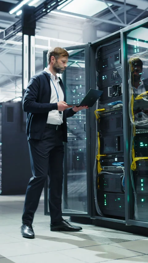 Vertical Screen Data Center Specialist Using Laptop Computer Stock Footage 320867595