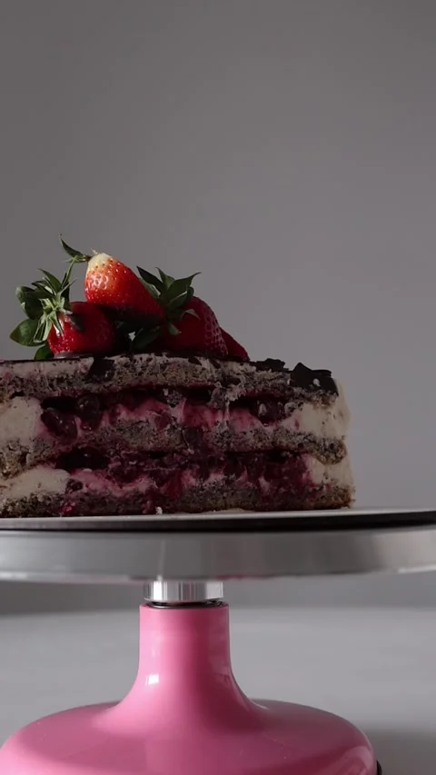Vertical screen: A delicious layered cake with creamy filling, berries, and fres Stock Footage 302794426