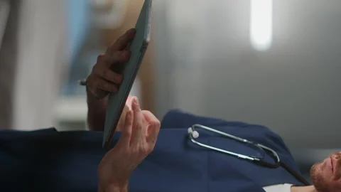 Vertical Screen Doctor Nurse using Tablet Computer Stock Footage 146077310