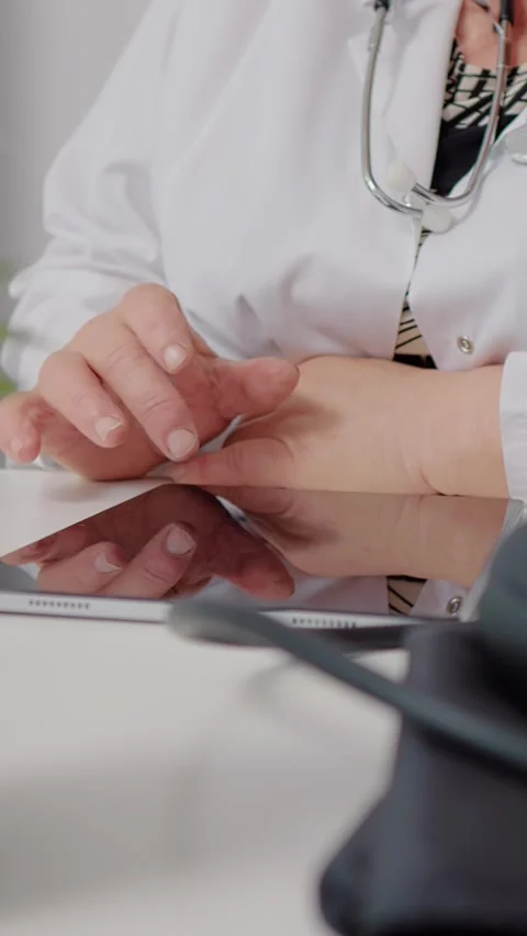 Vertical Screen doctor using technology to consult people remotely on tablet. Stock Footage 299992794