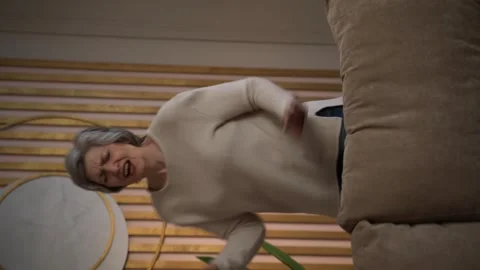 Vertical Screen: Elderly Woman Dancing in Living Room Stock Footage 278182992