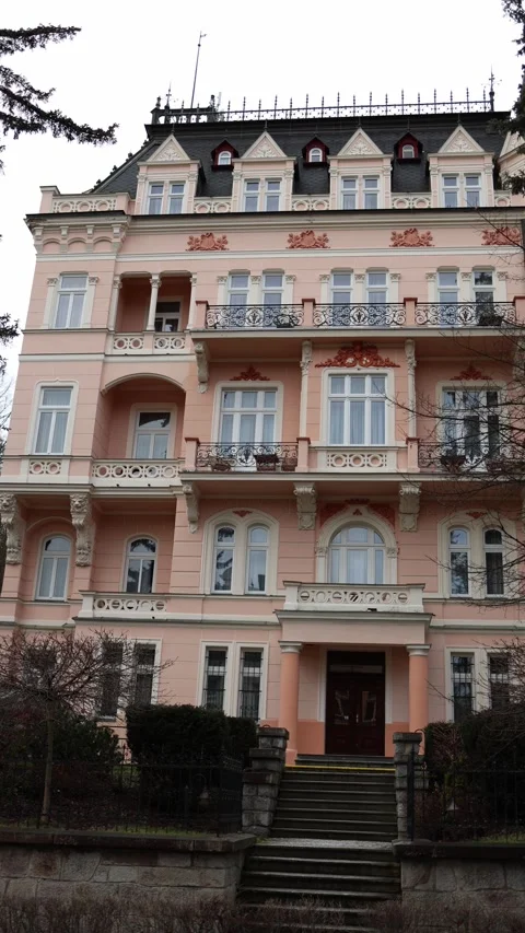 Vertical screen: An elegant mansion with a pink façade, detailed architecture, d Stock Footage 300540020