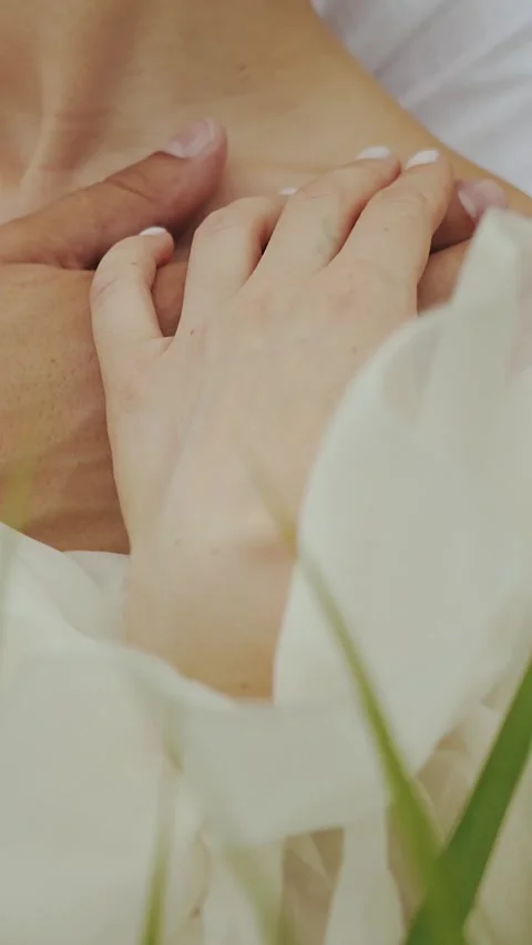 Vertical screen: Embrace of bride and groom, close-up of hands, hand touching Stock Footage 307776698