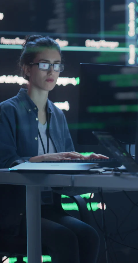 Vertical Screen Female Coding Surrounded by Screens Stock Footage 243290330