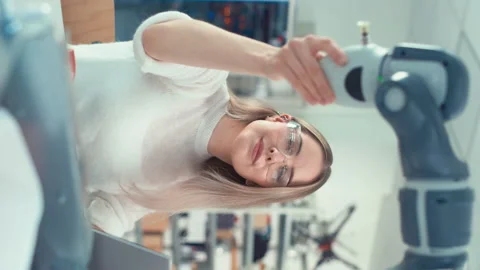 Vertical Screen Female Engineer Move Bionic Claw Stock Footage 187586685