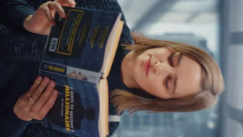 Vertical Screen Female Riding Elevator Reading Book 스톡 동영상 167841498