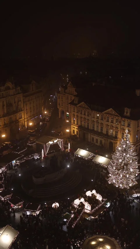 Vertical screen: A festive night view of a European Christmas market with beauti Stock Footage 296543832