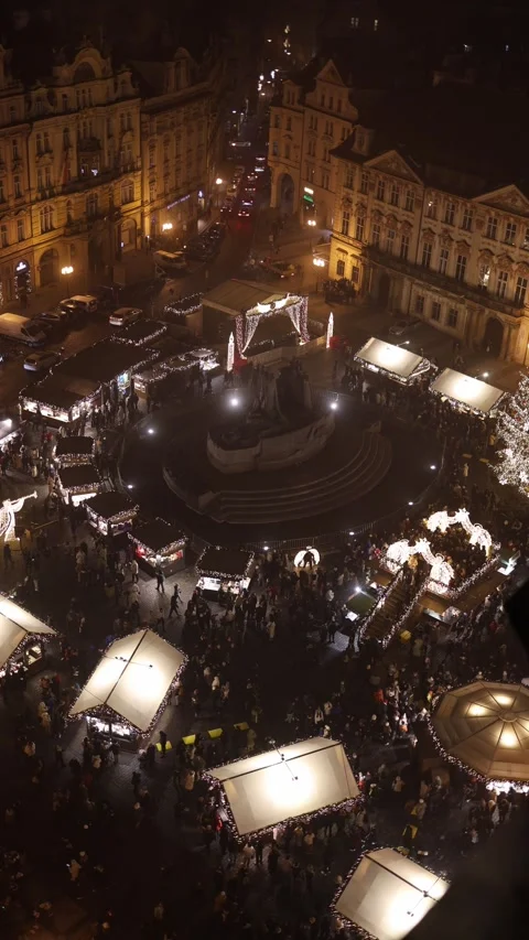 Vertical screen: A festive town square bustling with illuminated Christmas stall Stock Footage 296543766