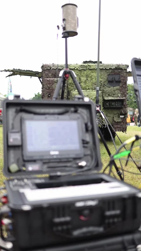 Vertical screen field command setup with rugged laptops antennas and camouflaged Stock Footage 311149812
