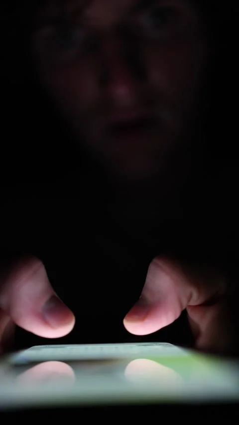 Vertical screen Fingers tapping on smartphone screen in the dark glowing light r Stock Footage 313842812