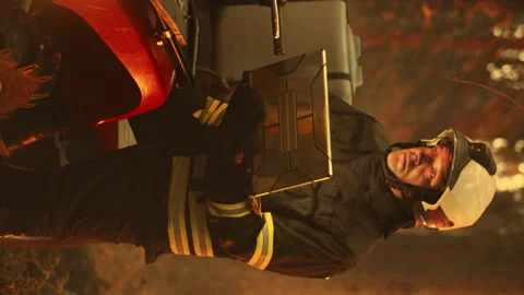 Vertical Screen Firefighter Using Laptop Computer in Wildland Fire Stock Footage 224561267