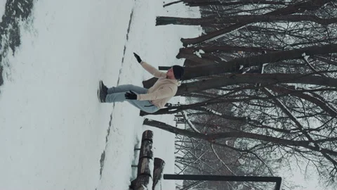 Vertical Screen: Fit man working out and doing burpee on snow Stock Footage 243216745