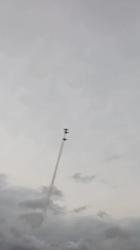Vertical screen five aerobatic planes shoot upward in vertical stack through lay Stock Footage 311150056