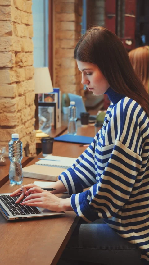 Vertical screen: Focused Study Session in Library Stock Footage 265680573