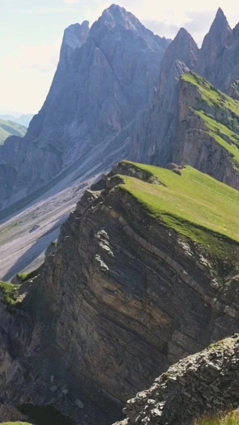 Vertical screen framing jagged peaks and sharp ridgeline of Seceda mountain Stock Footage 318384791