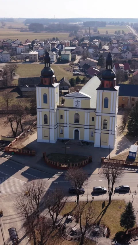 Vertical screen Frontal Aerial View Showing Stawiski Church Facade And Stock Footage 339999119