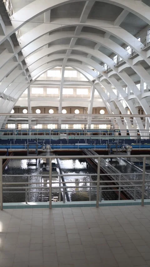 Vertical screen: Futuristic cathedral of infrastructure — a water treatment plan Stock Footage 304884046