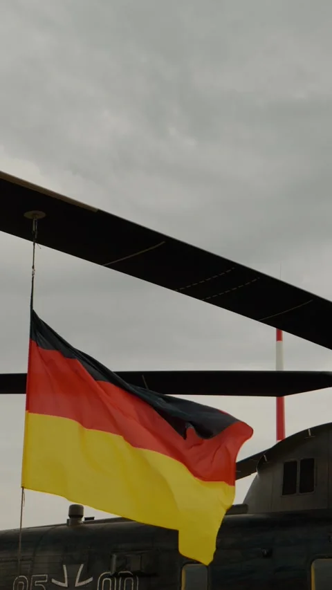 Vertical Screen German flag and the helicopter Sikorsky CH-53GS which Stock Footage 303507597