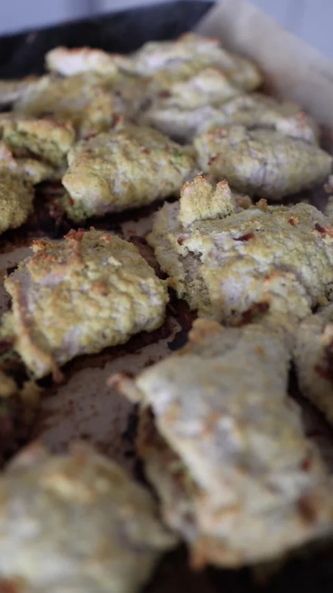 Vertical screen golden baked parcels fresh from the oven crispy crust uneven sha Stock Footage 306007225