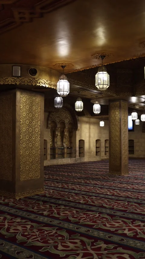 Vertical screen golden pillar inside richly decorated mosque warm lantern light  Stock Footage 310472254