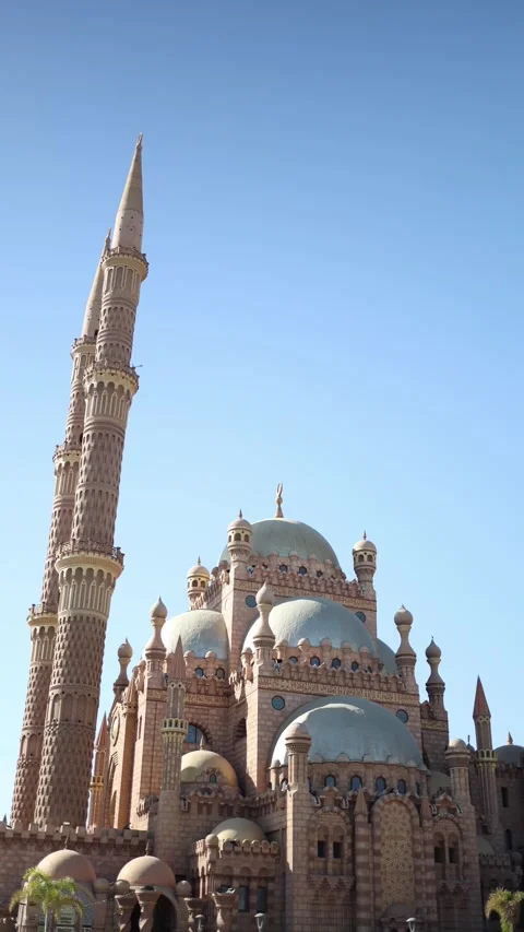 Vertical screen grand mosque silhouette golden domes towering minaret sandstone  Stock Footage 310012031