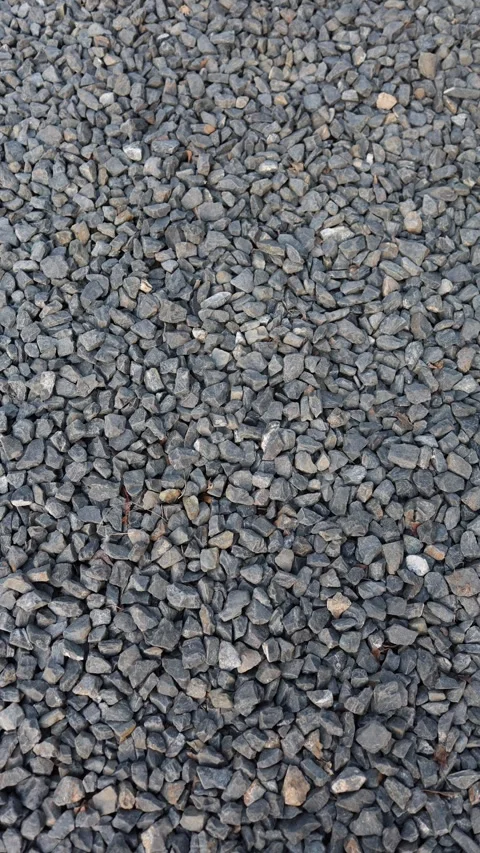 Vertical screen gravel texture dark stones rough surface natural background raw  Stock Footage 306007606