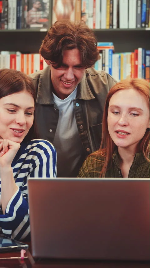 Vertical screen: Group of Students Collaborating in Library Stock Footage 280361852