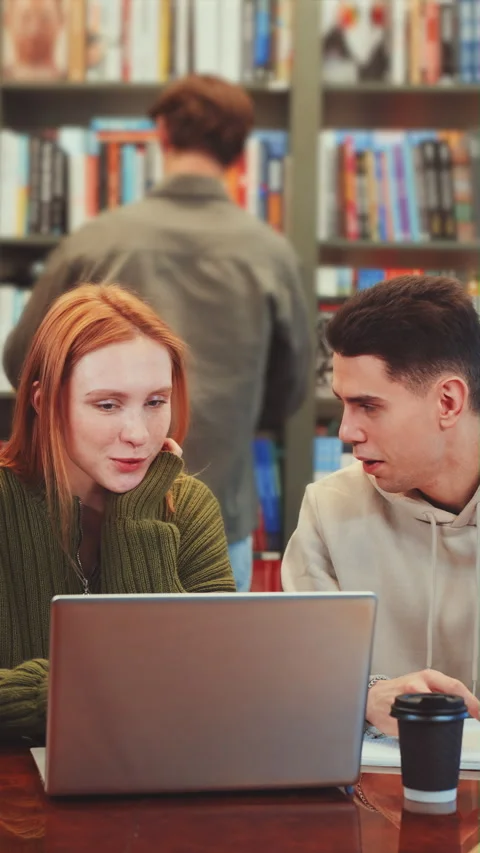 Vertical screen: Group of Students Studying in Library Stock Footage 279943232