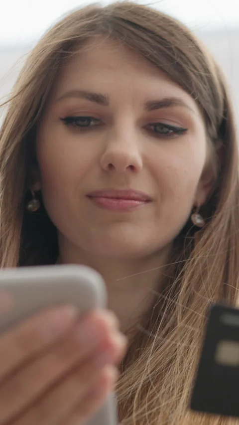 Vertical Screen: Hand of young women are buying online with a credit card. woman Stock Footage 274585698