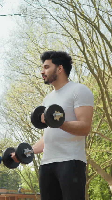 Vertical Screen: handsome muslim man standing together at green park and Stock Footage 274224988