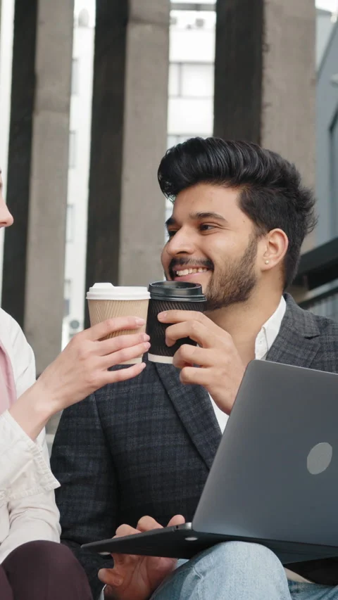 Vertical Screen: Happy muslim man and woman toasting with cups of coffee while Stock Footage 272831088