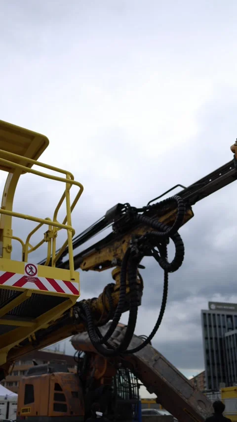 Vertical screen heavy construction drill rig with yellow safety platform massive Stock Footage 309540975