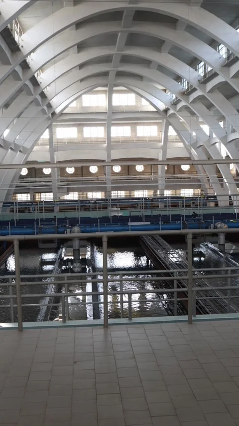 Vertical screen: Inside a major municipal water facility where critical filtrati Stock Footage 304884178